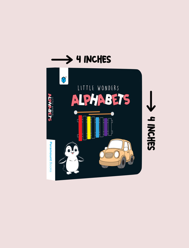 A children's alphabet board book shown on a pale pink background with measurement arrows and text indicating it is 4 inches by 4 inches. The cover is dark navy with colorful lettering, a penguin, and a small car illustration.