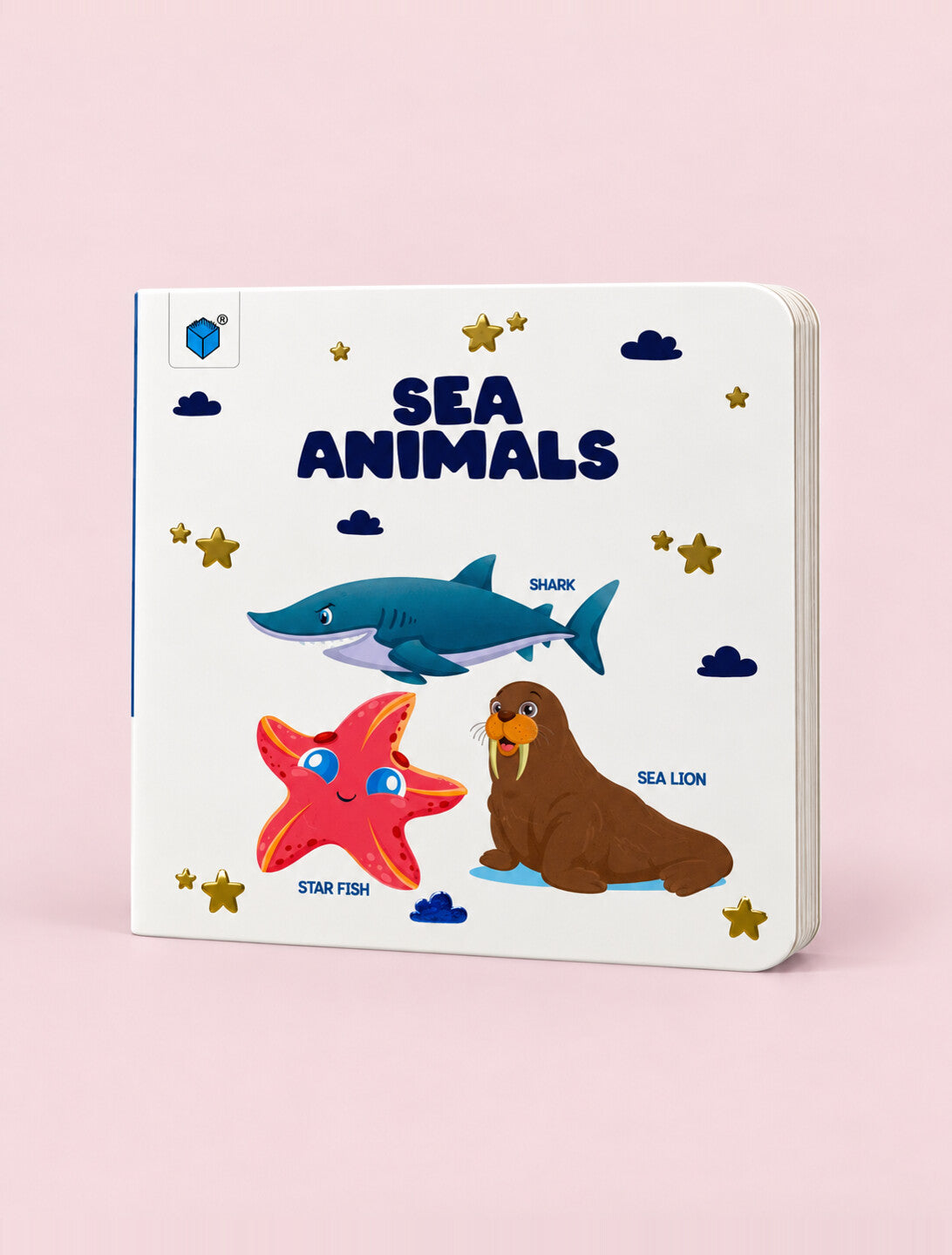 A children's hardcover book titled 'SEA ANIMALS' featuring colorful illustrations of a shark, starfish, and sea lion on a white cover, set against a solid pink background.